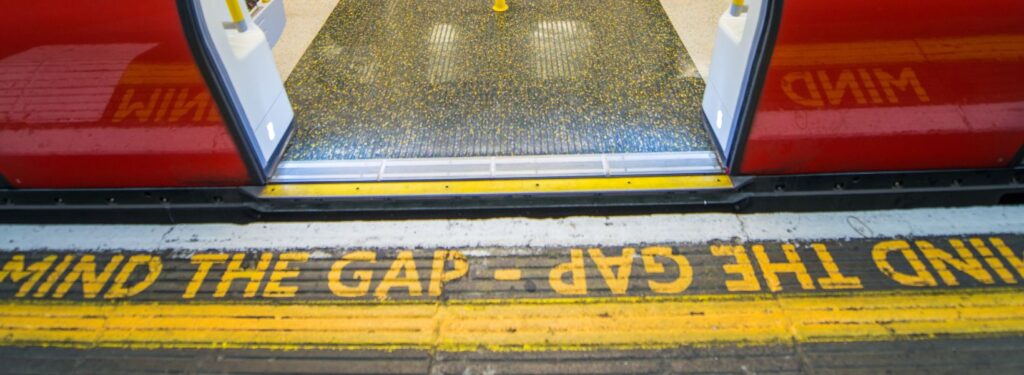 Subway platform with Mind the Gap warning